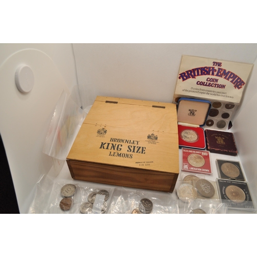 187 - A box containing an assortment of around the world coins to include Royal Mint Silver Crown and othe... 