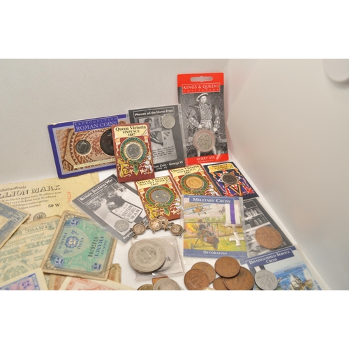 196 - A mixture of coins and notes from around the world, some silver and reproductions