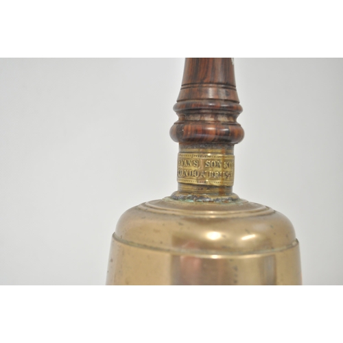 22 - 'Rare' heavy brass hand bell by Evans Sons & Co of London Bridge. Overall height approx 35cm.