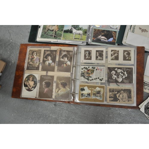 23 - Three postcard albums complete with a mixture of postcards and scenes with retro and vintage postcar... 