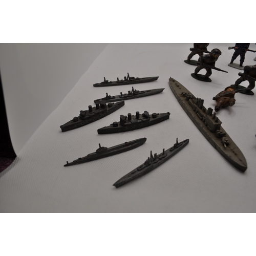 237 - Vintage diecast military figures together with seven miniature lead cast battleships A/F