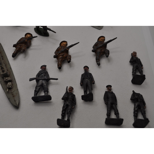 237 - Vintage diecast military figures together with seven miniature lead cast battleships A/F