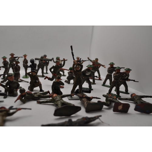 238 - Predominately diecast military soldiers of various nationalities, some with weapons and different st... 