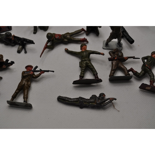 238 - Predominately diecast military soldiers of various nationalities, some with weapons and different st... 