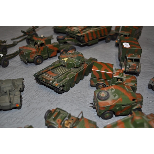 239 - A large selection of Dinky metal army vehicles to include; x3 651 centurion tanks, x1 623 wagon, x1 ... 