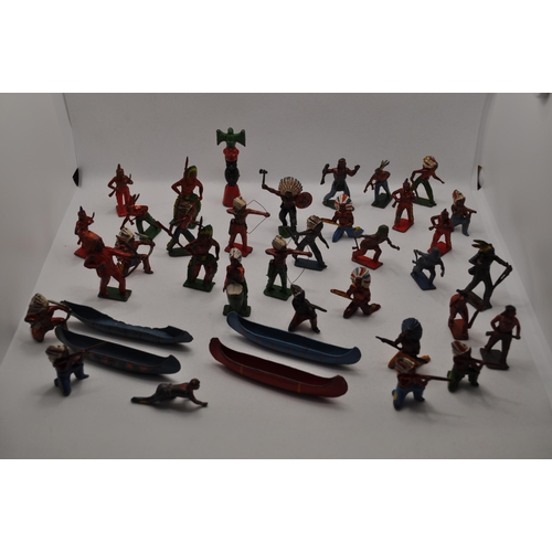 244 - Quantity of lead/hollow cast figures of Indian tribes, canoes,  in different poses/stances, Totem po... 