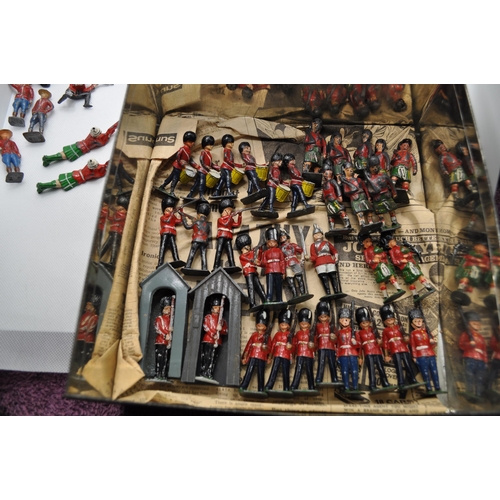 245 - Diecast military British guardsman In parade dress, guards on sentry duty, bandsman, Canadian and ot... 