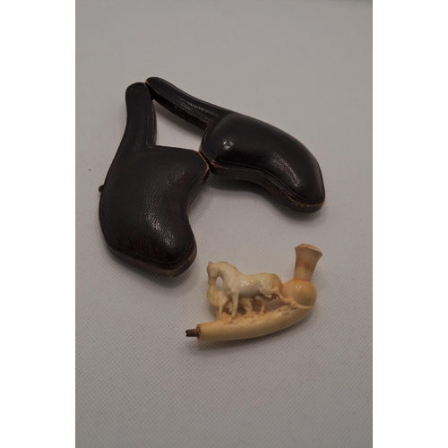 52 - Meerschaum pipe with carved horses design, in case.