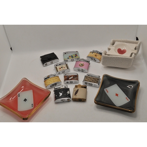 54 - A selection of 10 small lighters, with two sets of four ceramic and glass ashtrays with playing card... 