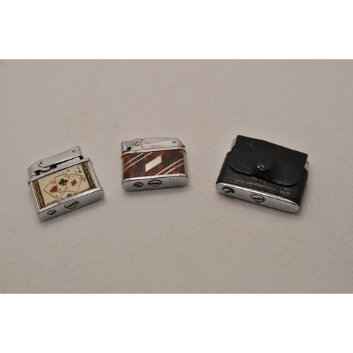 54 - A selection of 10 small lighters, with two sets of four ceramic and glass ashtrays with playing card... 