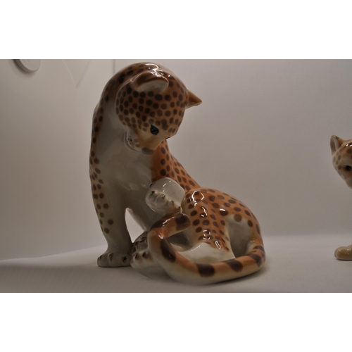 63 - Two Russian Lomonosov porcelain model of cheetah/leopards one larger figure and one smaller, both ma... 