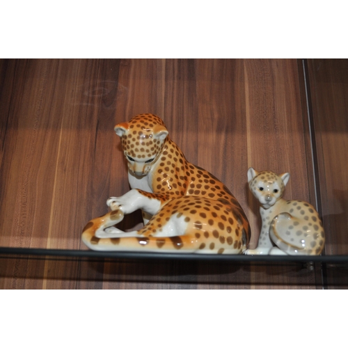 63 - Two Russian Lomonosov porcelain model of cheetah/leopards one larger figure and one smaller, both ma... 