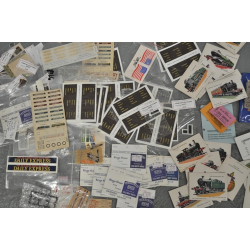 77 - A collection of railway related items including model train decals, old railway tickets, Hardback bo... 