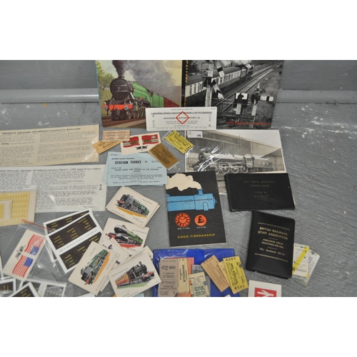 77 - A collection of railway related items including model train decals, old railway tickets, Hardback bo... 