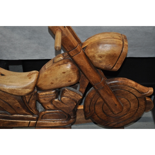 128 - A bespoke wooden child's rocker in the form of a motorcycle, approx H72cm x L100cm, x W38cm