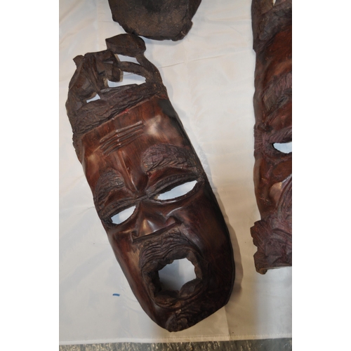 137 - Pair of African tribal masks and two hand carved wooden busts in the form of woman and child A/F