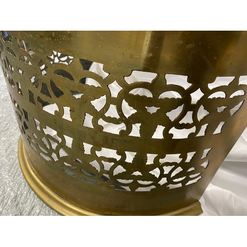 120 - Antique brass fender in curved design.