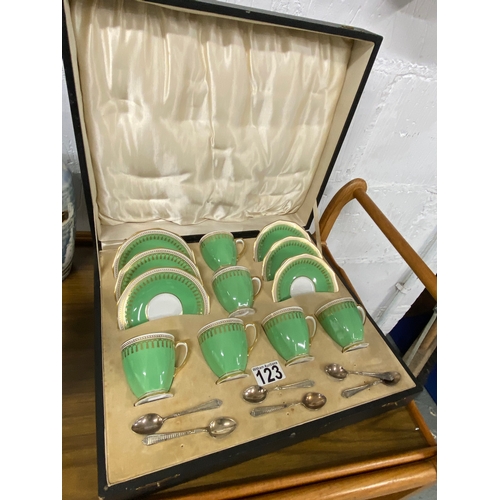 123 - A vintage cased set of Spode coffee cups and saucers (x6) with six silver teaspoons with engine turn... 