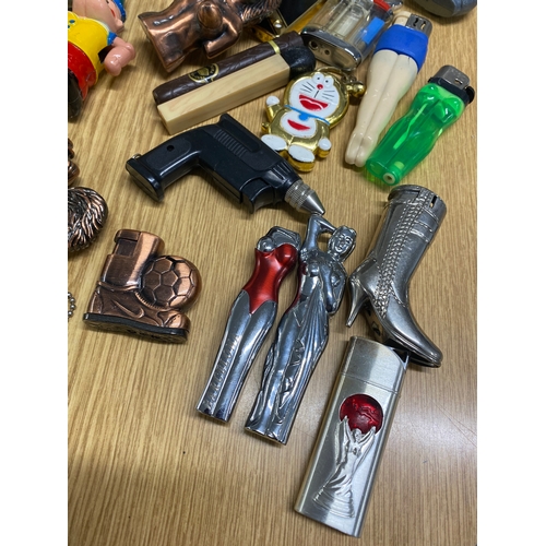 60 - In excess of 65 novelty lighters of varying designs and shapes including gun in holster, tools, chew... 