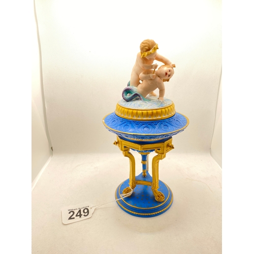 249 - Antique bisque porcelain lidded pedestal vessel featuring playful cherubs/ mélusin by Jean Gille, ma... 