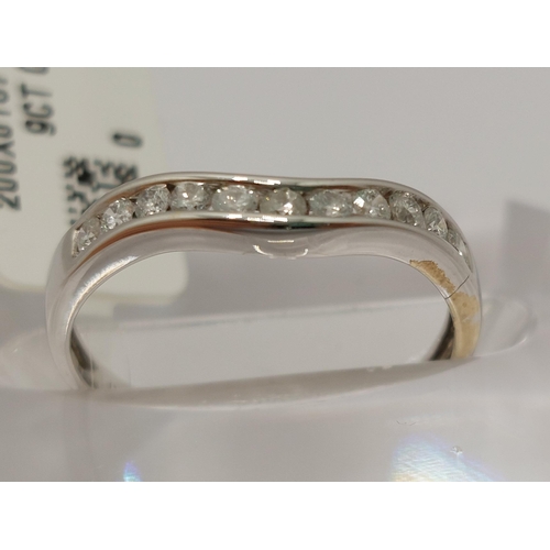 15 - White gold and diamond ring, featuring a row of x11 round cut diamonds, approx gross 0.25cts, hallma... 