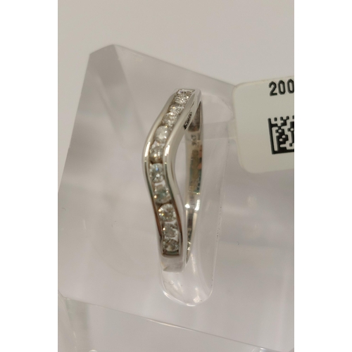 15 - White gold and diamond ring, featuring a row of x11 round cut diamonds, approx gross 0.25cts, hallma... 