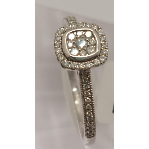 27 - 18ct white gold and diamond ring of  square shaped/design, approx 0.22cts,  hallmarked 750. Size is ... 