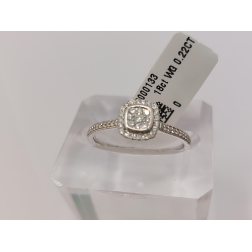 27 - 18ct white gold and diamond ring of  square shaped/design, approx 0.22cts,  hallmarked 750. Size is ... 