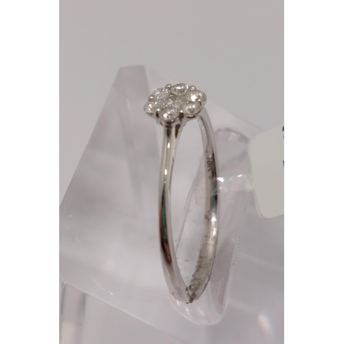 28 - 18ct white gold and diamond ring of flower shape design, approx 0.25ct, approx size M/N, hallmarked ... 