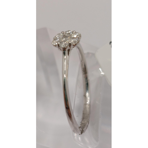 28 - 18ct white gold and diamond ring of flower shape design, approx 0.25ct, approx size M/N, hallmarked ... 