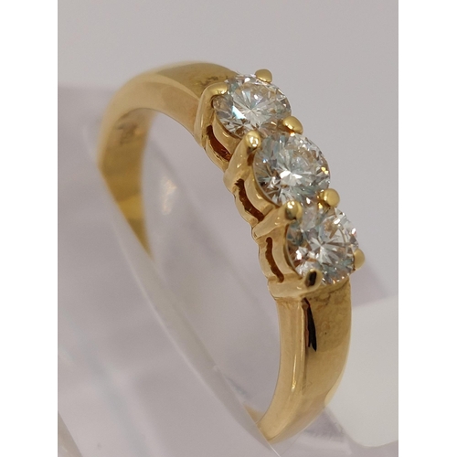 30 - An 18ct yellow gold diamond trilogy ring, approx 0.75cts, stamped 750, approx size N