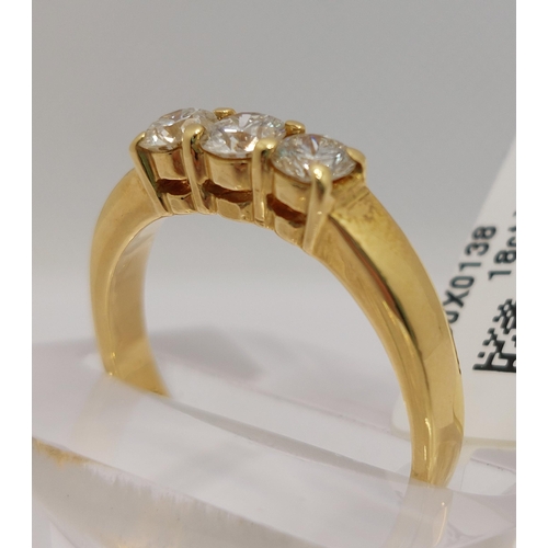 30 - An 18ct yellow gold diamond trilogy ring, approx 0.75cts, stamped 750, approx size N