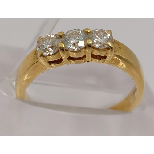 30 - An 18ct yellow gold diamond trilogy ring, approx 0.75cts, stamped 750, approx size N