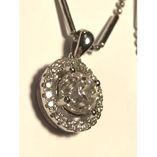 42 - 18ct white gold 0.55ct diamond pendant on an 18ct gold chain, both stamped 750