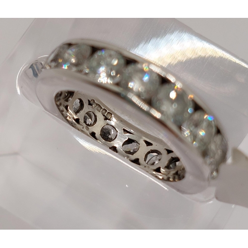 59 - Platinum and diamond full eternity ring, x17 stones of approx 3.4cts in total, approx size J