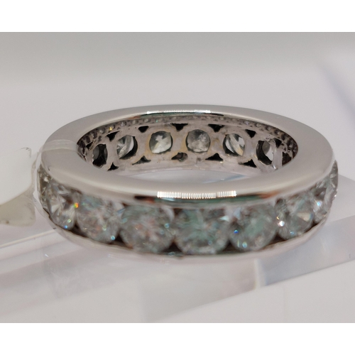 59 - Platinum and diamond full eternity ring, x17 stones of approx 3.4cts in total, approx size J