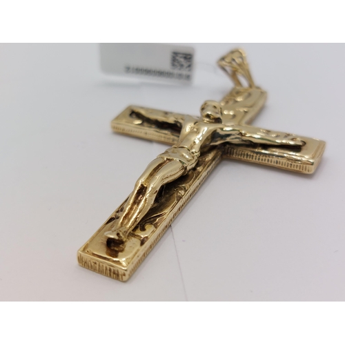 60 - A substantial 9ct gold pendant in the form of  Jesus on the Crucifix overall length 7cm with hallmar... 