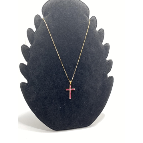 72 - Yellow gold ruby and diamond cross pendant with 9ct yellow gold trace necklace