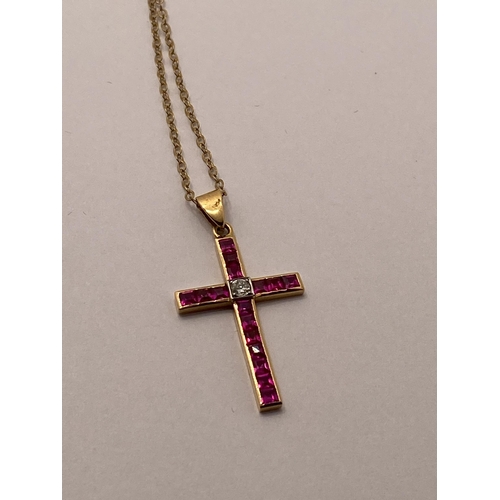 72 - Yellow gold ruby and diamond cross pendant with 9ct yellow gold trace necklace