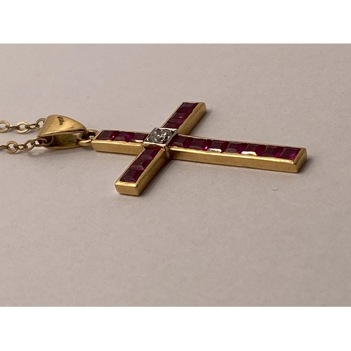 72 - Yellow gold ruby and diamond cross pendant with 9ct yellow gold trace necklace