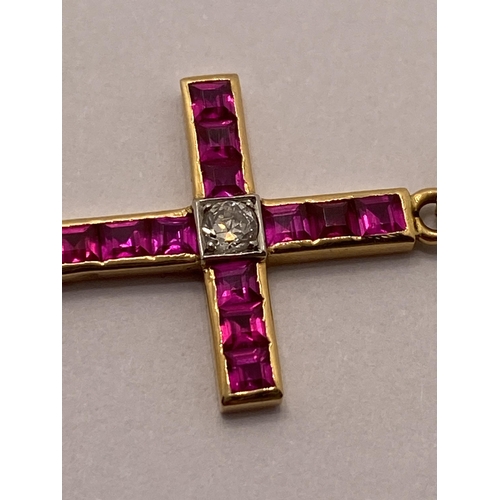 72 - Yellow gold ruby and diamond cross pendant with 9ct yellow gold trace necklace