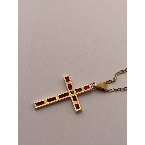 72 - Yellow gold ruby and diamond cross pendant with 9ct yellow gold trace necklace