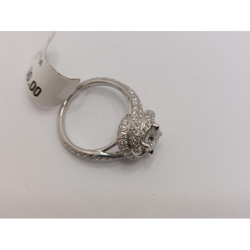 76 - Platinum and diamond ring swirl ring, approx 0.75ct, hallmarked Birmingham 950, approx size H/I