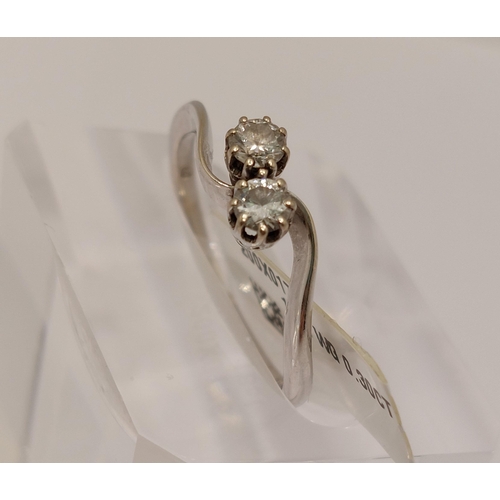 9 - 18ct white gold diamond ring in an interlocking twin stone design, approx 0.30cts, size O/P