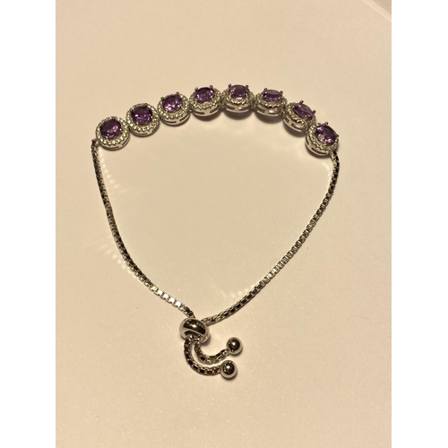 106 - Silver and CZ with amethyst line bracelet with slide attachment, marked S925