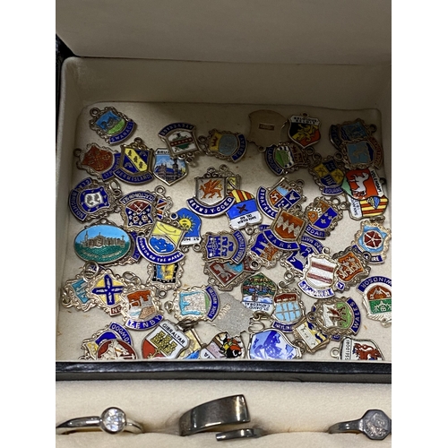 130 - A jewellery box containing a quantity of costume jewellery to include silver chains, bracelets, ambe... 