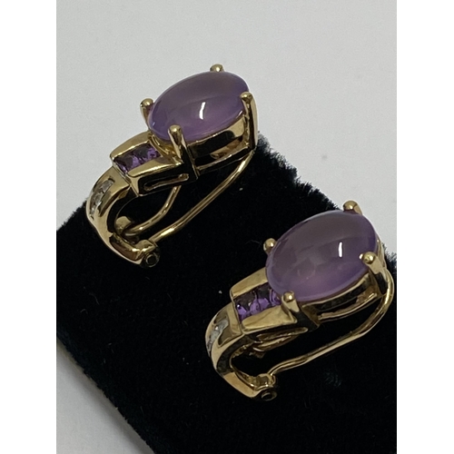 149 - A pair of yellow gold pink tourmaline stud earrings with diamonds, stamped 10k  with  clasps