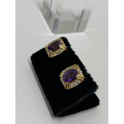 150 - A pair of yellow gold amethyst and diamond earrings stamped 14k. approx gross weight 5.7g