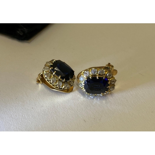 151 - A pair of sapphire and diamond clip on cluster earings, of approx 4ct total