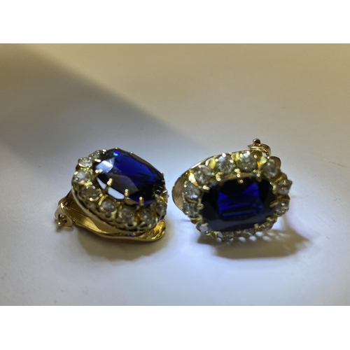 151 - A pair of sapphire and diamond clip on cluster earings, of approx 4ct total